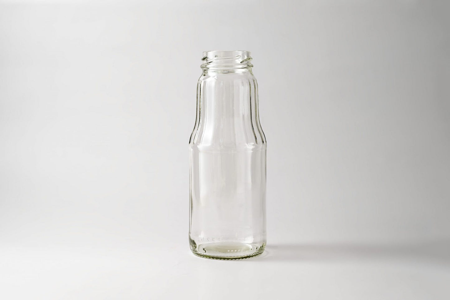 Glass juice bottle 1.0 L. Lids included.