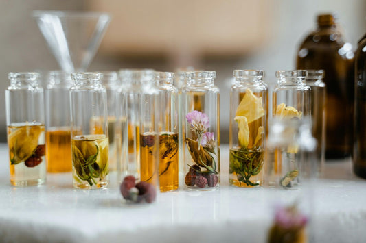 small glass bottles with wooden lids