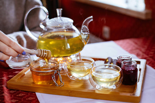 small jars of honey  glass sample jars