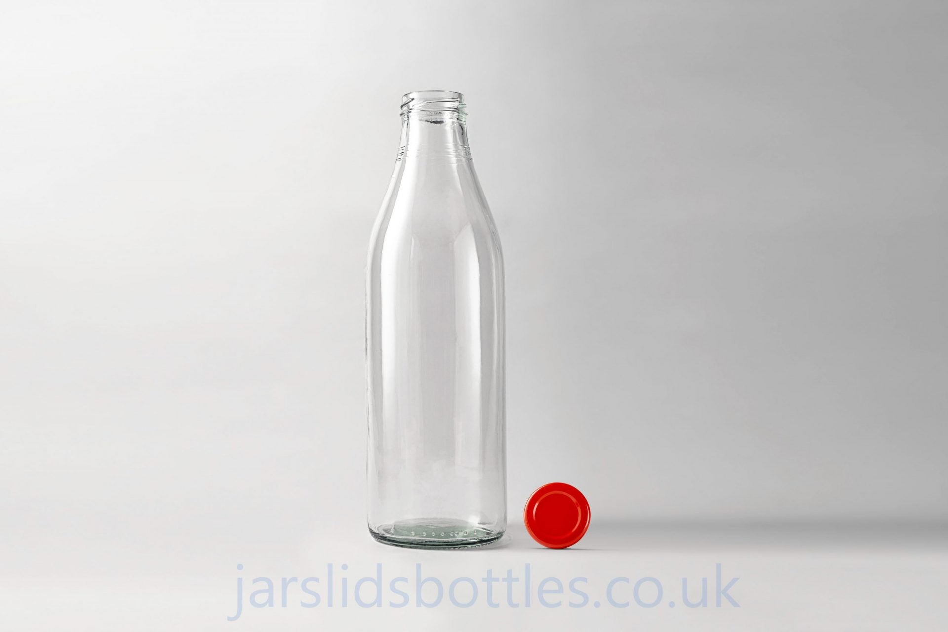 Glass milk bottle 1.0 L. Lids included.