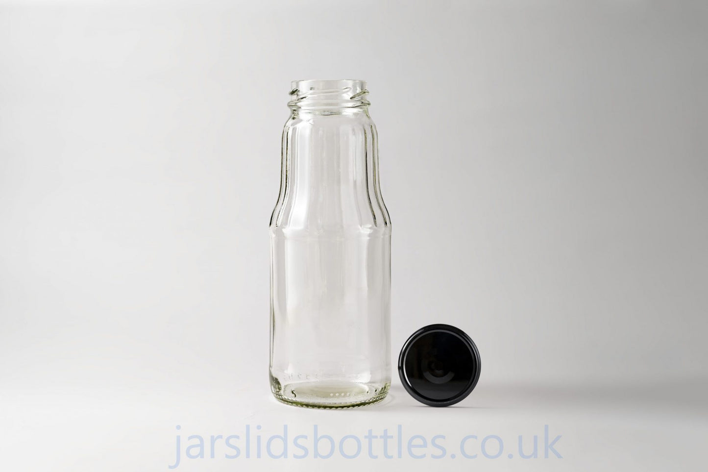 Glass juice bottle 1.0 L. Lids included.