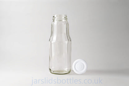 Glass juice bottle 1.0 L. Lids included.