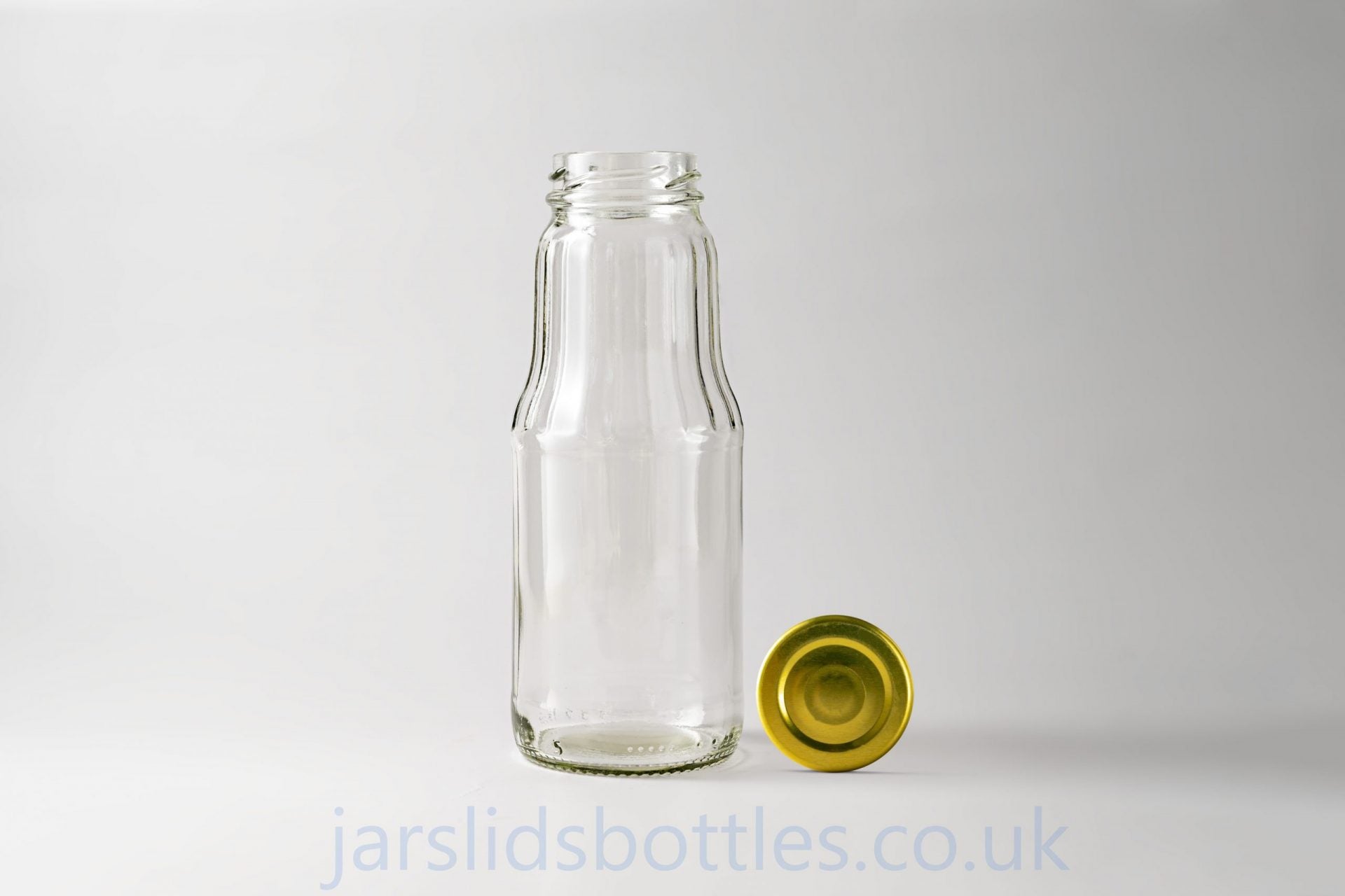 Glass juice bottle 1.0 L. Lids included.